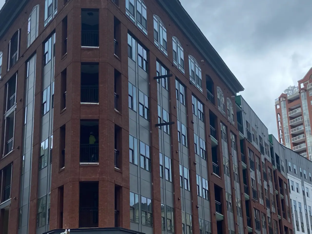Modern multi-story brick and glass mixed-use commercial building project