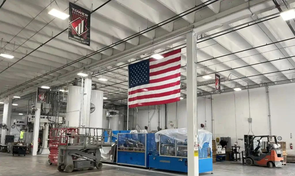 Tower Sealants Gainesville Georgia manufacturing facility interior with American flag and production line
